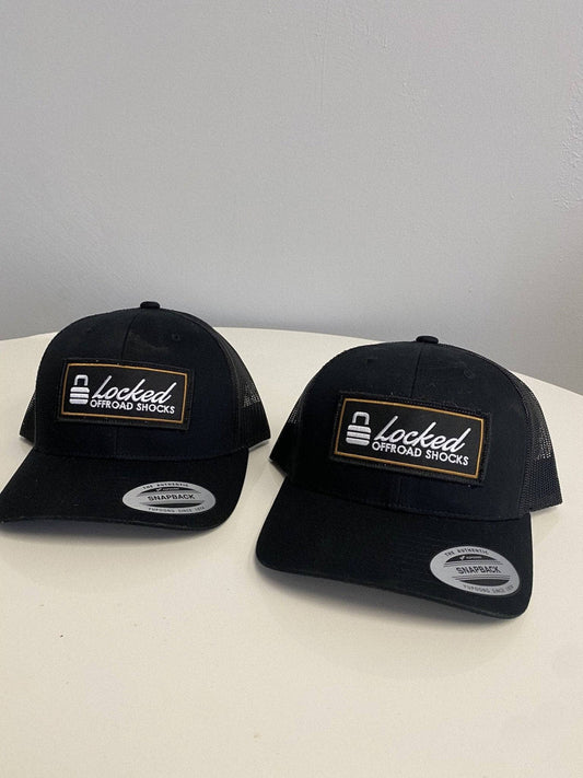 Black https://www.lockedoffroad.com/cdn/shop/files/locked-offroad-shocks-apparel-default-title-locked-offroad-snap-back-38415409185012_1080x.jpg?v=1742858493